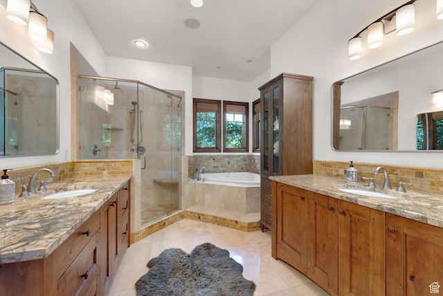 3327 E Wasatch Pines Ln, Sandy, UT 84092 - full bathroom featuring two vanities, a shower stall, a bath, and tile patterned flooring