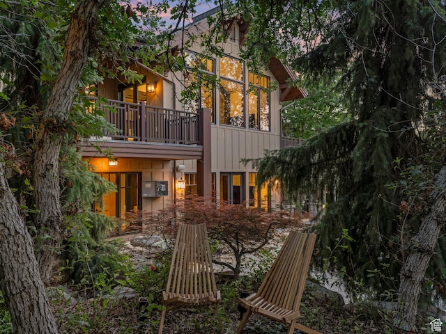 3327 E Wasatch Pines Ln, Sandy, UT 84092 - back of house featuring a balcony and board and batten siding