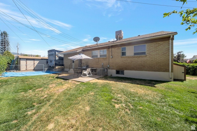144 W 4575 S, Washington Terrace, UT 84405 - rear view of property featuring a storage shed, brick siding, and a patio area