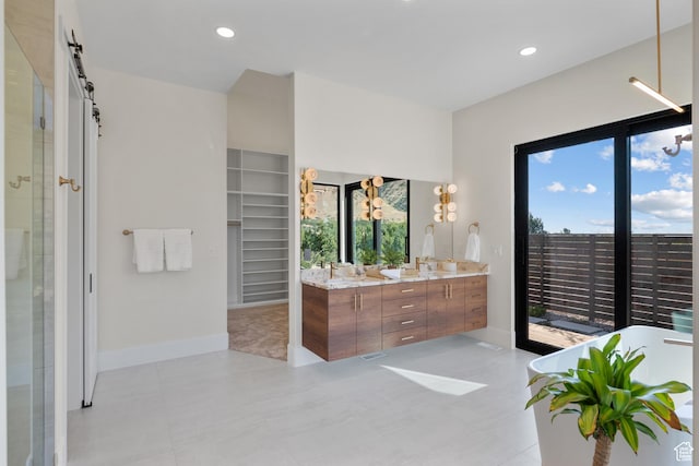 1882 N Main St, Mapleton, UT 84664 - bathroom featuring double vanity, a shower stall, a soaking tub, a spacious closet, and recessed lighting