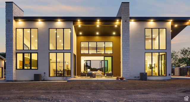 1882 N Main St, Mapleton, UT 84664 - back of house at dusk with an outdoor living space
