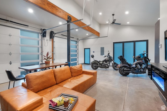 1882 N Main St, Mapleton, UT 84664 - living room featuring electric panel, finished concrete floors, a ceiling fan, recessed lighting, and a high ceiling