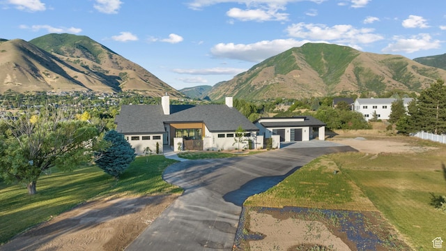 1882 N Main St, Mapleton, UT 84664 - view of front of house with a chimney, driveway, and a mountain view