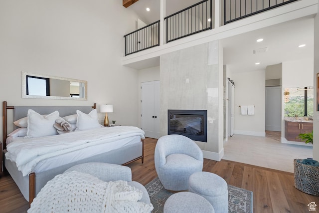 1882 N Main St, Mapleton, UT 84664 - bedroom with a high ceiling, wood finished floors, a fireplace, and recessed lighting