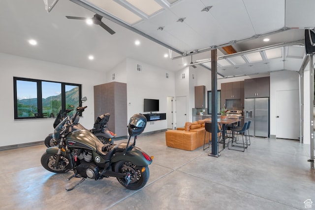 1882 N Main St, Mapleton, UT 84664 - garage featuring stainless steel fridge with ice dispenser, recessed lighting, and ceiling fan