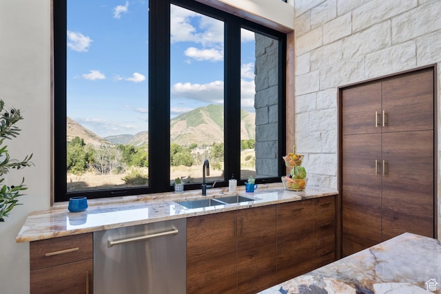 1882 N Main St, Mapleton, UT 84664 - kitchen with stainless steel dishwasher, light stone countertops, plenty of natural light, and modern cabinets
