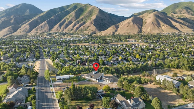 1882 N Main St, Mapleton, UT 84664 - aerial overview of property's location featuring nearby suburban area and a mountainous background