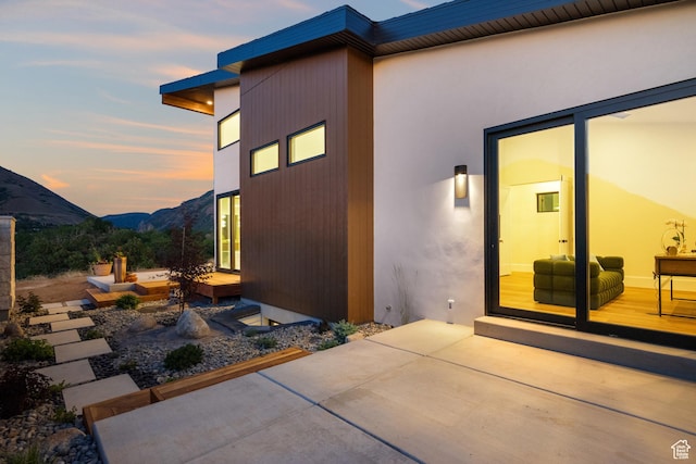 1882 N Main St, Mapleton, UT 84664 - property exterior at dusk with a patio and a mountain view