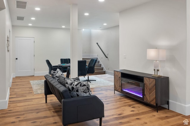 1882 N Main St, Mapleton, UT 84664 - living room with stairway, light wood-style floors, and recessed lighting