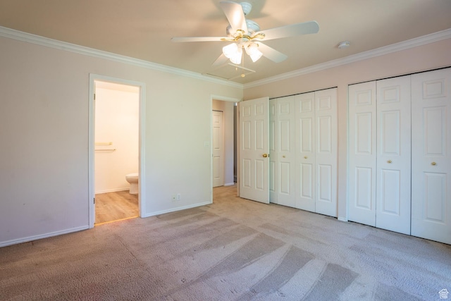 192 N 690 E, Tooele, UT 84074 - unfurnished bedroom featuring carpet floors, multiple closets, crown molding, connected bathroom, and ceiling fan