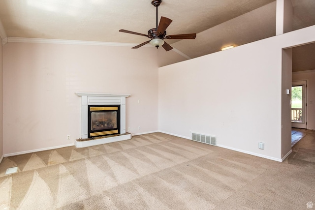 192 N 690 E, Tooele, UT 84074 - unfurnished living room with carpet floors, a glass covered fireplace, a ceiling fan, crown molding, and a towering ceiling