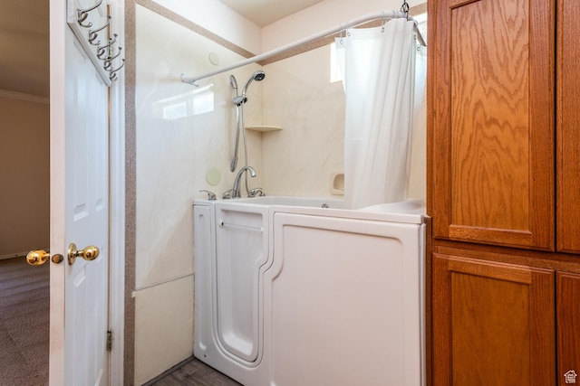 192 N 690 E, Tooele, UT 84074 - bathroom featuring washer / clothes dryer, shower / tub combo, and ornamental molding