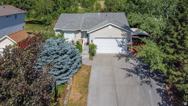 192 N 690 E, Tooele, UT 84074 - view of front facade featuring a garage, concrete driveway, and a shingled roof
