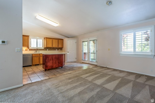 192 N 690 E, Tooele, UT 84074 - kitchen featuring dishwasher, light countertops, ornamental molding, light colored carpet, and light tile patterned flooring