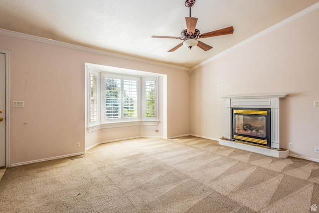 192 N 690 E, Tooele, UT 84074 - unfurnished living room featuring carpet flooring, a ceiling fan, ornamental molding, and a glass covered fireplace