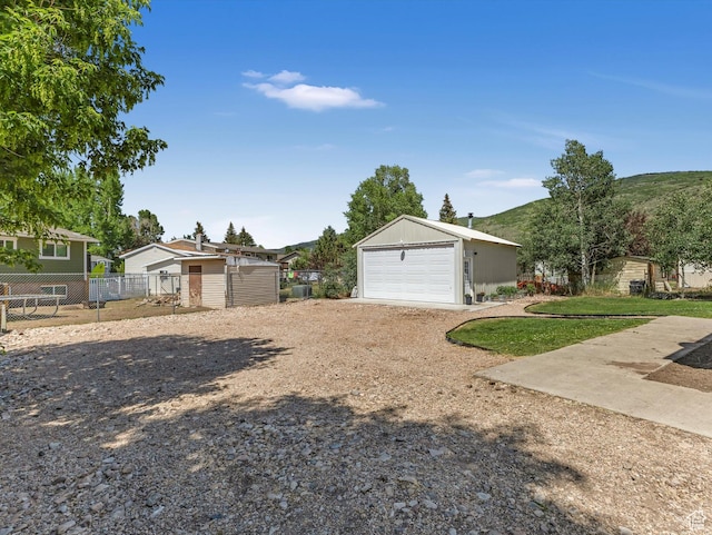155 Hawthorne, Kamas, UT 84036 - view of front facade featuring an outbuilding and a detached garage