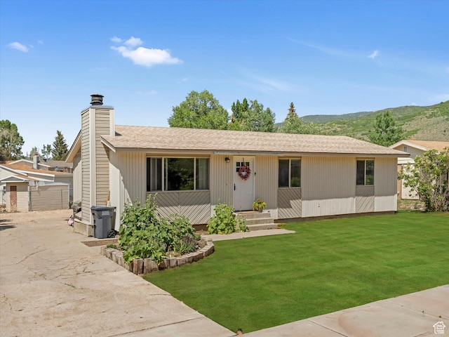 155 Hawthorne, Kamas, UT 84036 - single story home featuring a front lawn, a chimney, a mountain view, and a shingled roof