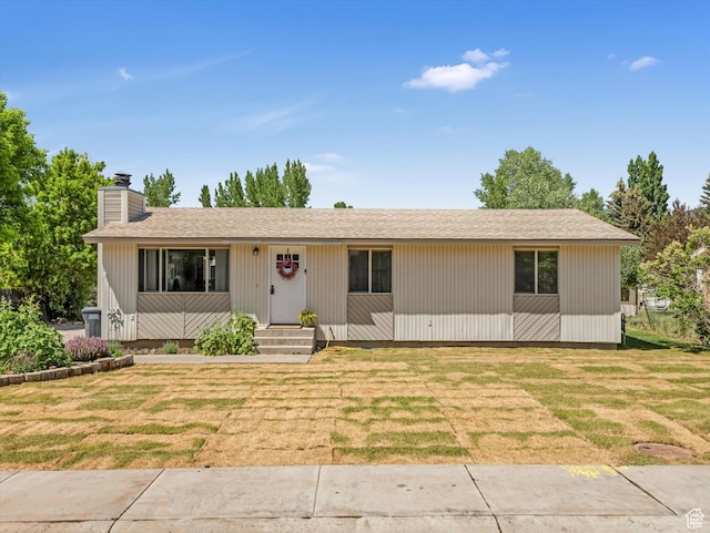 155 Hawthorne, Kamas, UT 84036 - view of front of house with a front lawn and a chimney