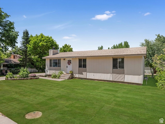 155 Hawthorne, Kamas, UT 84036 - view of front facade featuring a front yard and a chimney
