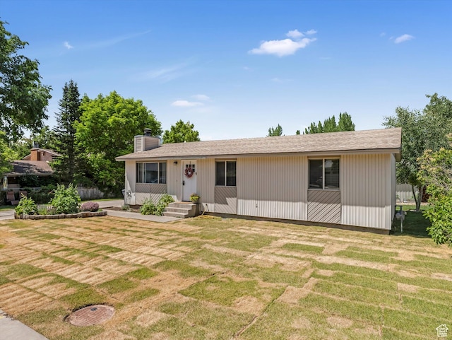155 Hawthorne, Kamas, UT 84036 - view of front of house with a front lawn and a chimney