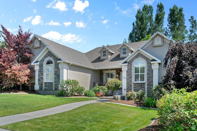 352 E Maple Dr, Alpine, UT 84004 - traditional-style house featuring stone siding, stucco siding, a front yard, and roof with shingles