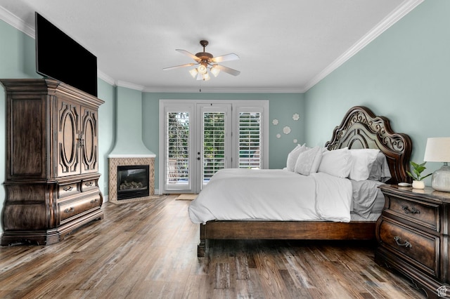 352 E Maple Dr, Alpine, UT 84004 - bedroom featuring access to outside, ornamental molding, wood finished floors, a fireplace with flush hearth, and ceiling fan
