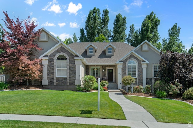 352 E Maple Dr, Alpine, UT 84004 - view of front of house with stone siding, stucco siding, and a front lawn