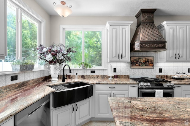 352 E Maple Dr, Alpine, UT 84004 - kitchen with stainless steel appliances, custom exhaust hood, healthy amount of natural light, and tasteful backsplash