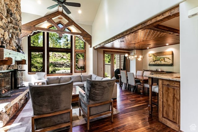 8789 Marsac Ave Unit 4, Park City, UT 84060 - living room with a stone fireplace, a ceiling fan, a chandelier, dark wood-style floors, and high vaulted ceiling
