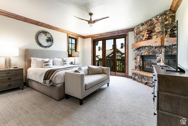 8789 Marsac Ave Unit 4, Park City, UT 84060 - bedroom featuring access to exterior, a stone fireplace, carpet flooring, and a ceiling fan