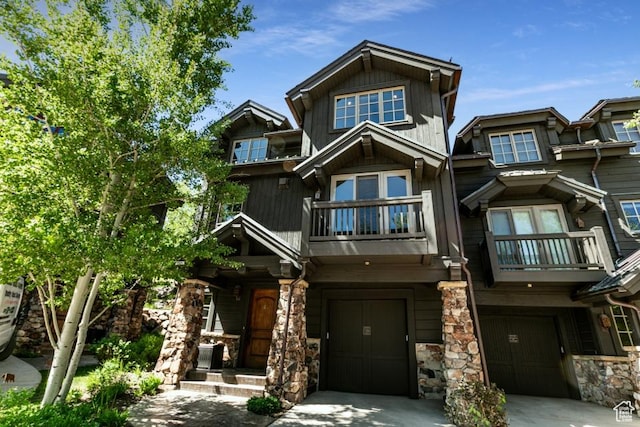 8789 Marsac Ave Unit 4, Park City, UT 84060 - craftsman house with a balcony, a garage, stone siding, and concrete driveway