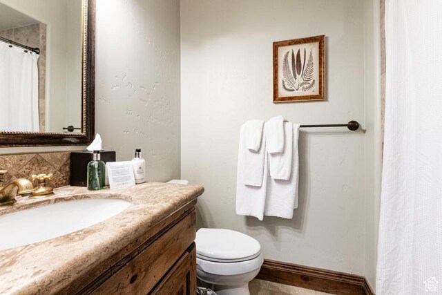 8789 Marsac Ave Unit 4, Park City, UT 84060 - bathroom featuring vanity, a shower with shower curtain, and decorative backsplash