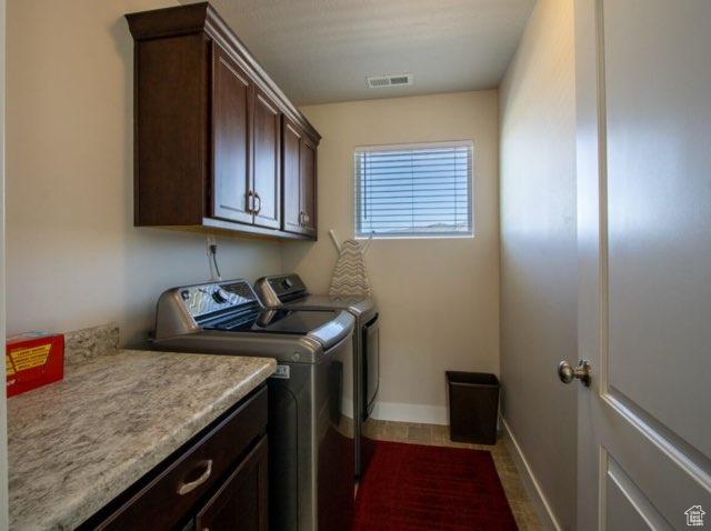 4910 N Deseret Peak Dr, Eagle Mountain, UT 84005 - laundry room featuring cabinet space and washing machine and dryer