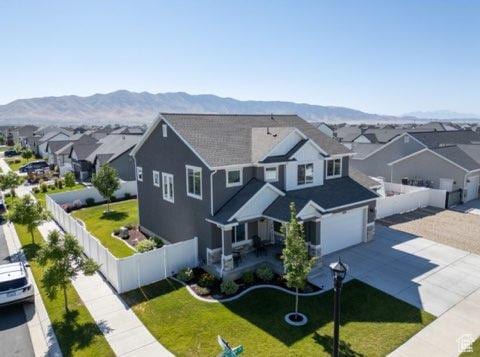 4910 N Deseret Peak Dr, Eagle Mountain, UT 84005 - aerial view of residential area with a mountain backdrop