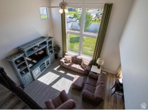 4910 N Deseret Peak Dr, Eagle Mountain, UT 84005 - living room with healthy amount of natural light, ceiling fan, and wood finished floors