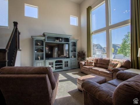 4910 N Deseret Peak Dr, Eagle Mountain, UT 84005 - living room featuring a towering ceiling