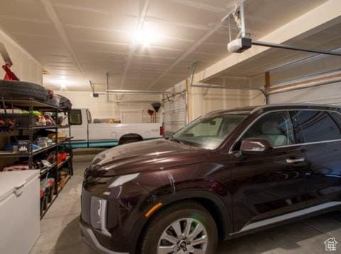 4910 N Deseret Peak Dr, Eagle Mountain, UT 84005 - garage featuring a garage door opener and fridge