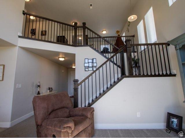 4910 N Deseret Peak Dr, Eagle Mountain, UT 84005 - stairs with a high ceiling and carpet