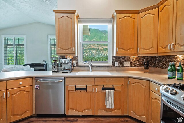 11789 S Nicklaus Rd, Sandy, UT 84092 - kitchen with stainless steel appliances, lofted ceiling, light countertops, tasteful backsplash, and dark wood-type flooring