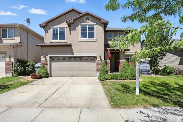 1061 N Bellingham Ct W, North Salt Lake, UT 84054 - traditional-style home with stucco siding, an attached garage, a front yard, brick siding, and concrete driveway