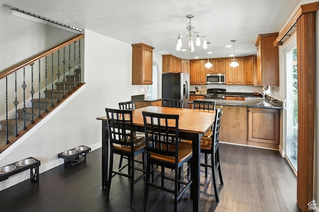 1061 N Bellingham Ct W, North Salt Lake, UT 84054 - dining room featuring a chandelier, dark wood-type flooring, stairs, and recessed lighting