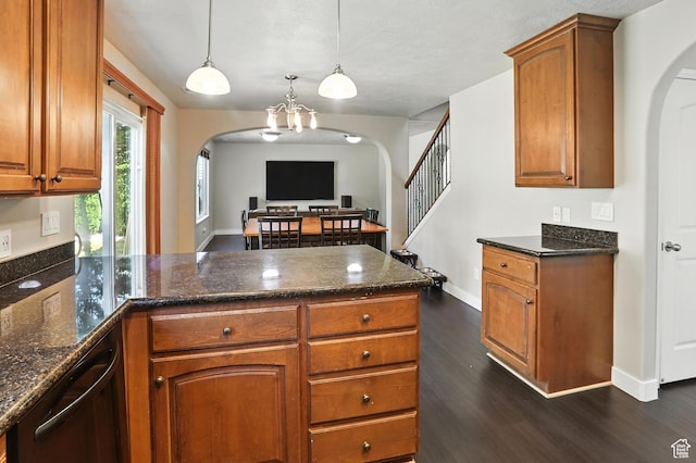 1061 N Bellingham Ct W, North Salt Lake, UT 84054 - kitchen with arched walkways, a peninsula, dark wood finished floors, and brown cabinets