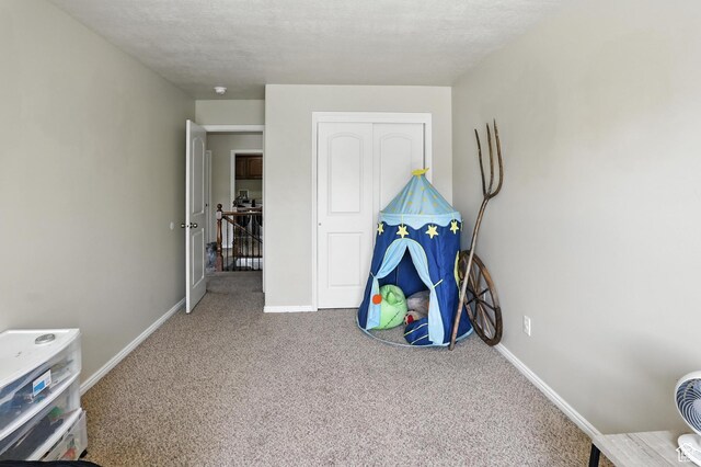 1061 N Bellingham Ct W, North Salt Lake, UT 84054 - rec room with carpet floors and baseboards