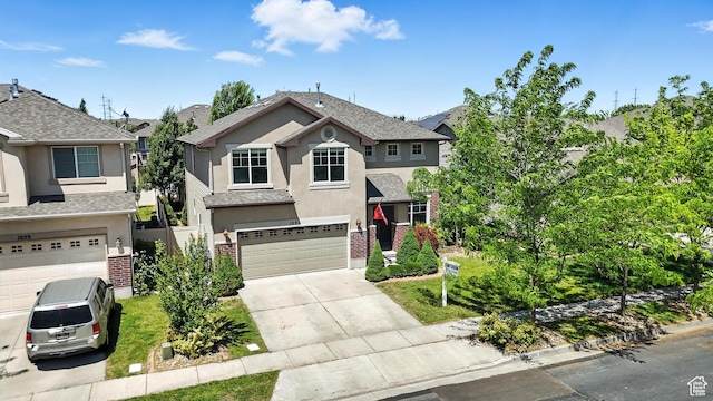 1061 N Bellingham Ct W, North Salt Lake, UT 84054 - traditional-style home with stucco siding, a garage, driveway, and brick siding
