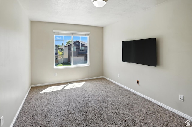 1061 N Bellingham Ct W, North Salt Lake, UT 84054 - carpeted spare room featuring baseboards and a textured ceiling