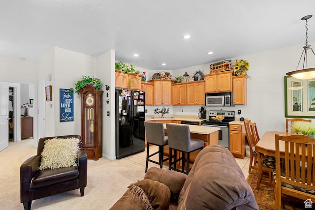 14857 S Treseder St, Draper, UT 84020 - kitchen featuring appliances with stainless steel finishes, light countertops, a center island, recessed lighting, and open floor plan