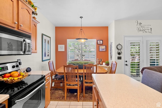 14857 S Treseder St, Draper, UT 84020 - kitchen featuring stainless steel appliances, light countertops, pendant lighting, and light tile patterned flooring