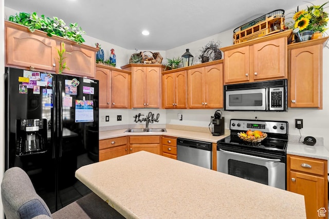 14857 S Treseder St, Draper, UT 84020 - kitchen with stainless steel appliances, light countertops, a breakfast bar, and recessed lighting