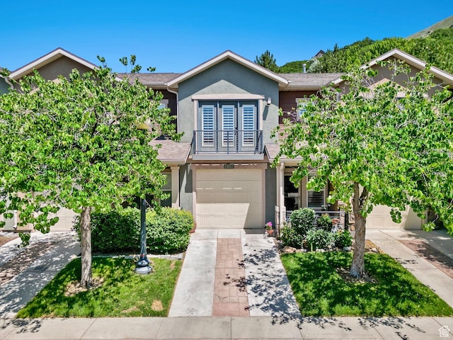 14857 S Treseder St, Draper, UT 84020 - view of front of house featuring stucco siding, driveway, and an attached garage