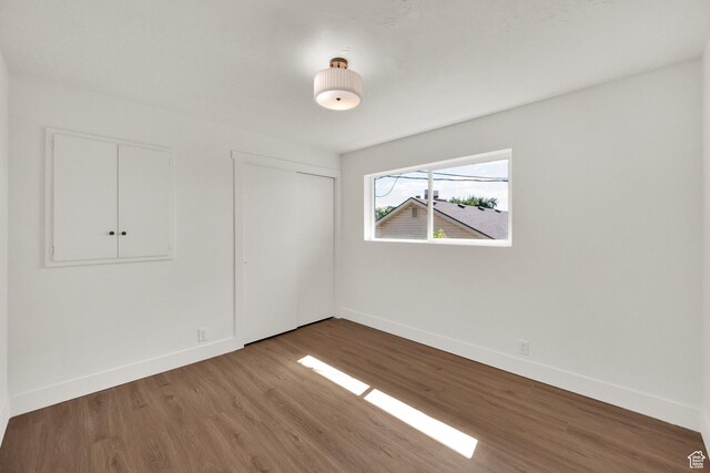 468 W 2400 S, Bountiful, UT 84010 - unfurnished bedroom with wood finished floors and a closet